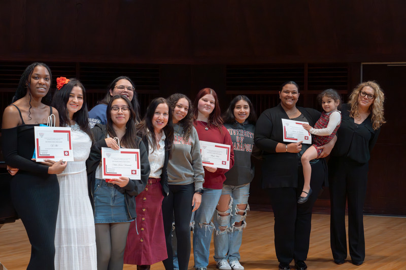 group of student's being recognized with certificates