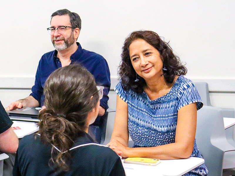 faculty talking with student