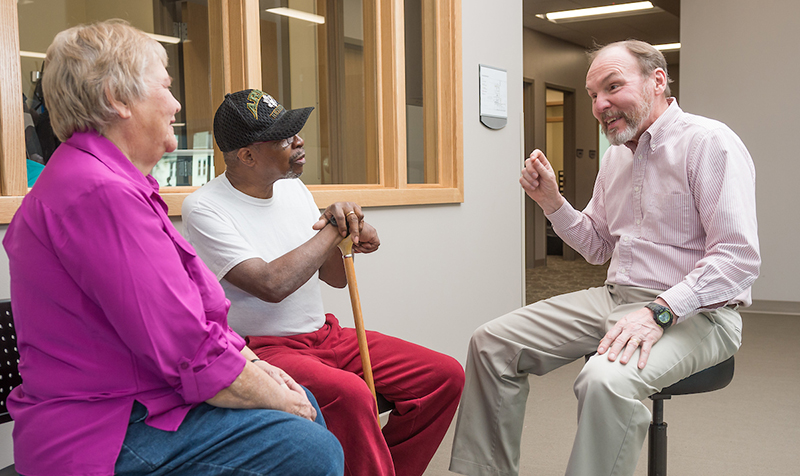 older faculty talks with senior adults