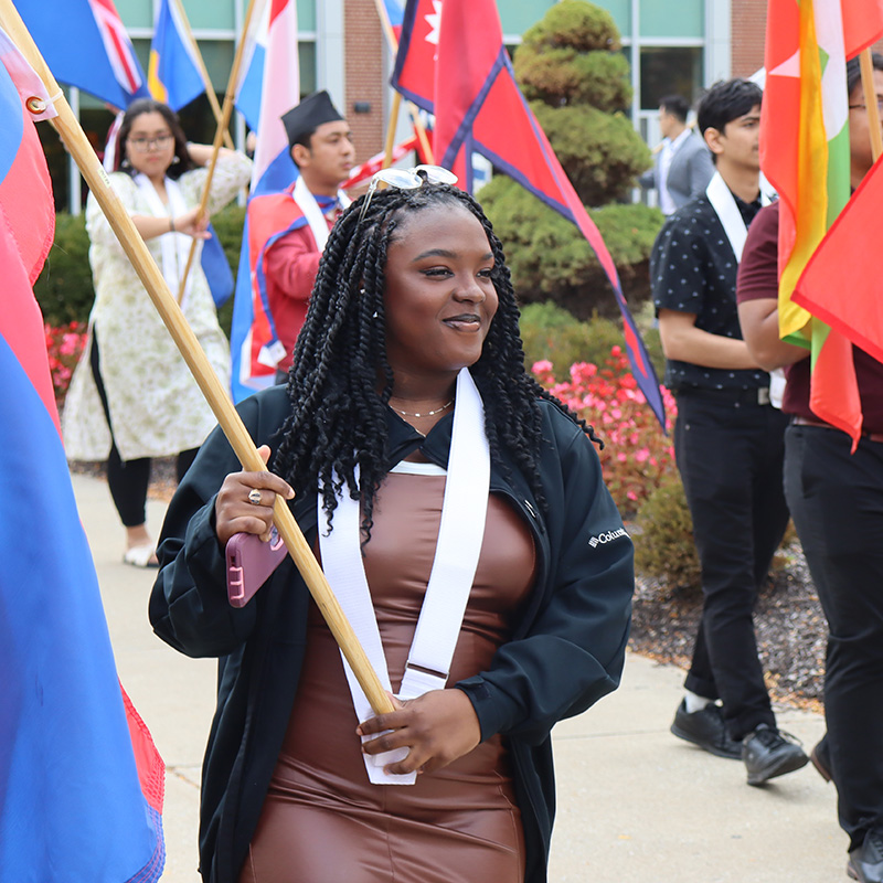 students holding national flags