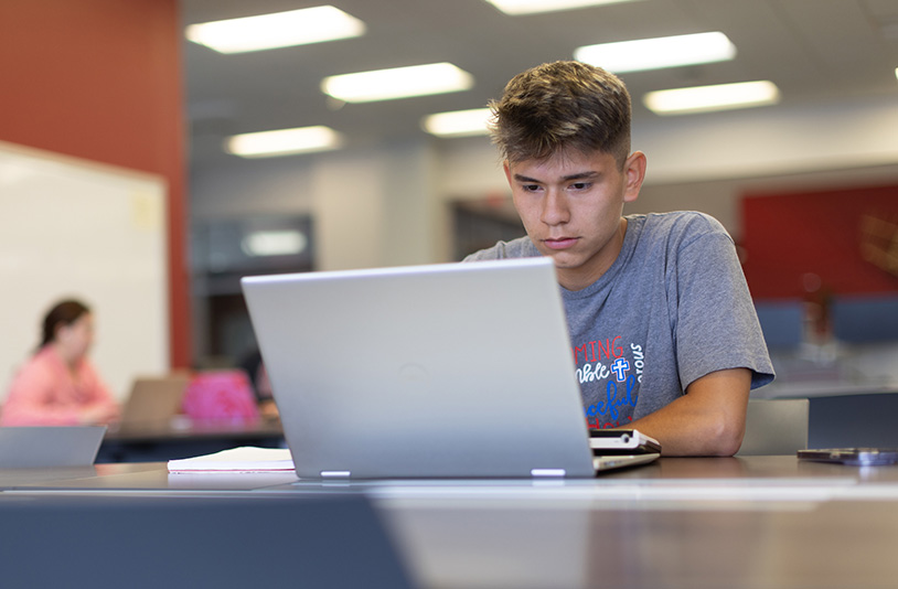 student on his laptop