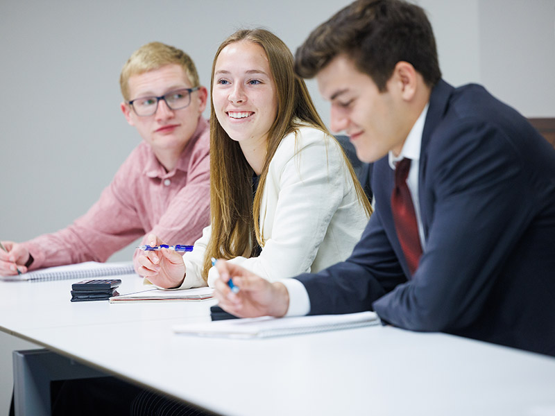 business students smiling
