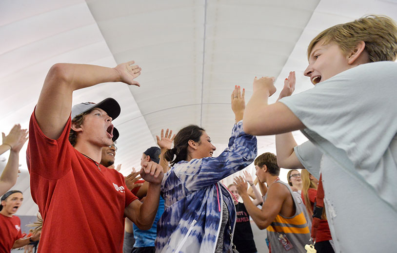 students giving each other high-fives