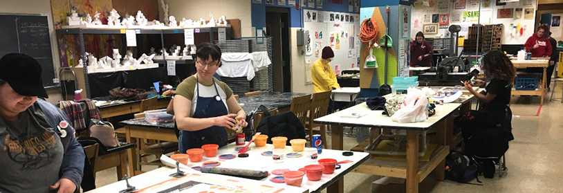 several students working in the printmaking studio