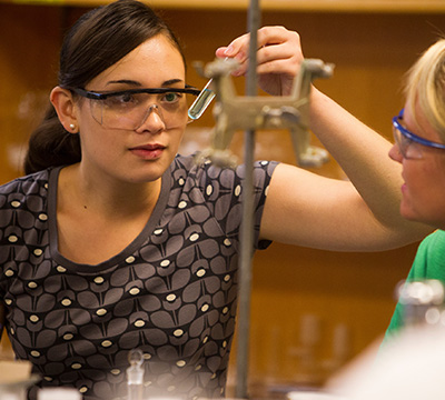 student holding a test tube