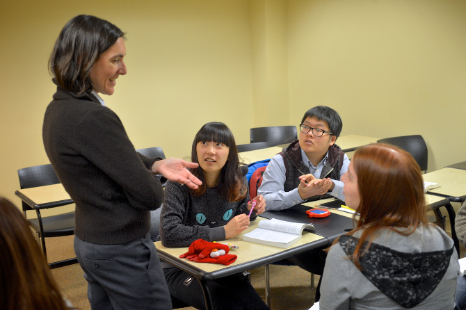 teacher in class talking to students