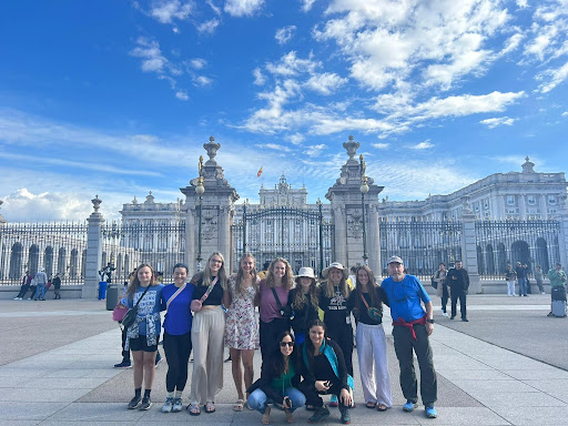group of study abroad students in front of a large building