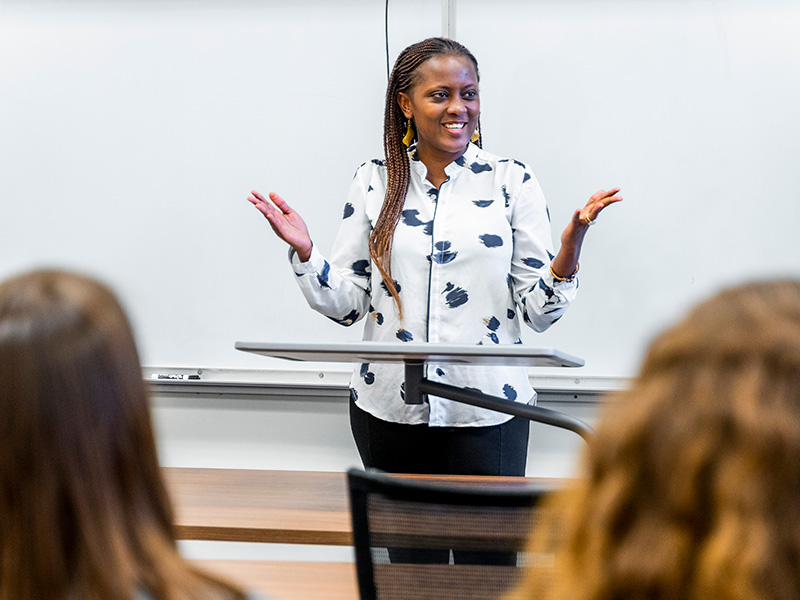 woman speaking at a podium