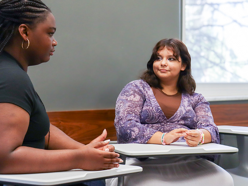 students having a discussion in class