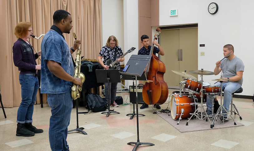 student playing music together
