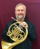 Darin Sorley holding french horn