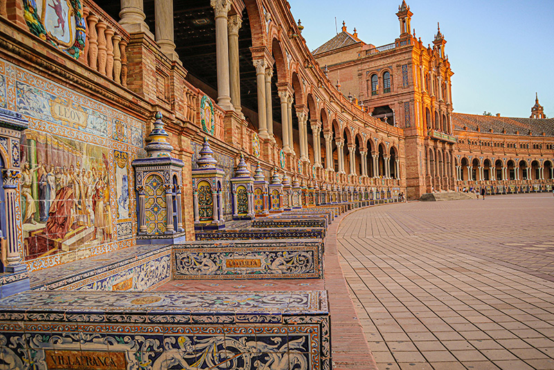 road made of stone tiles and building with columns
