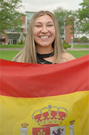 Ariana Doeden holding the Spanish flag