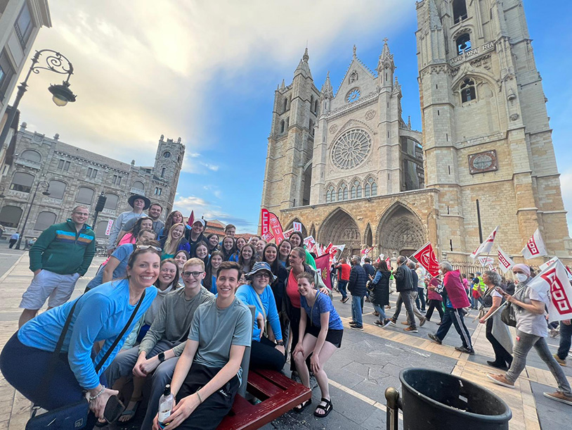 Faculty and students pose near a cathedral during their Spain trip