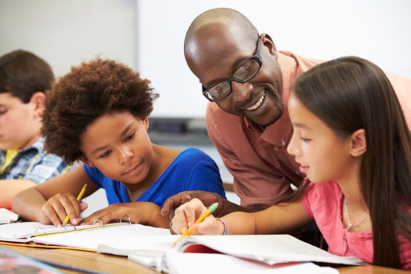 teacher with young students
