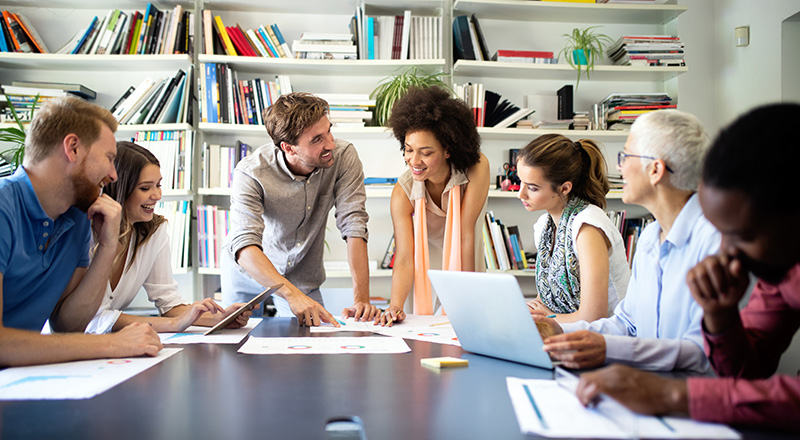 group of people working together discussing data