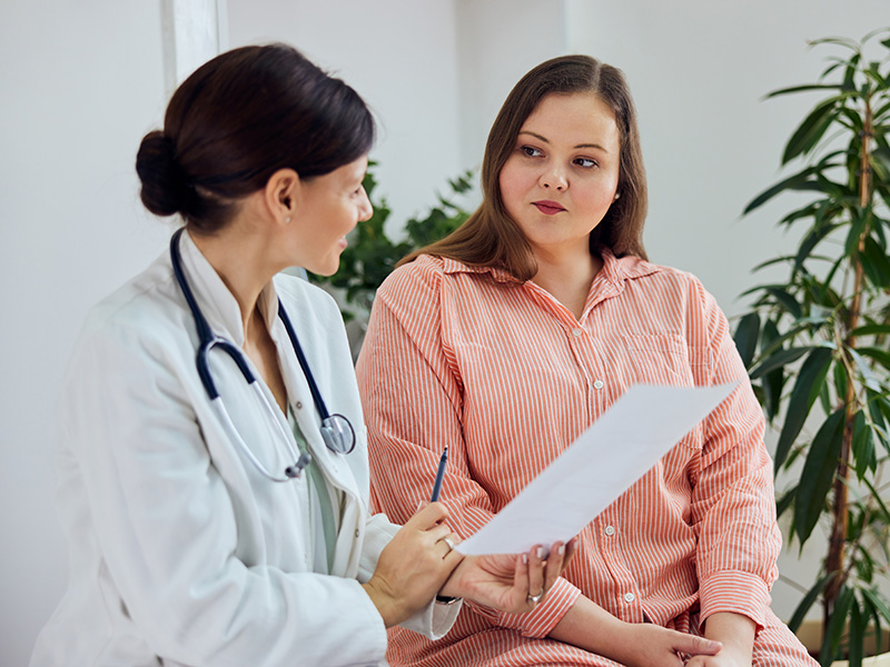 a health professional has a conversation with their patient
