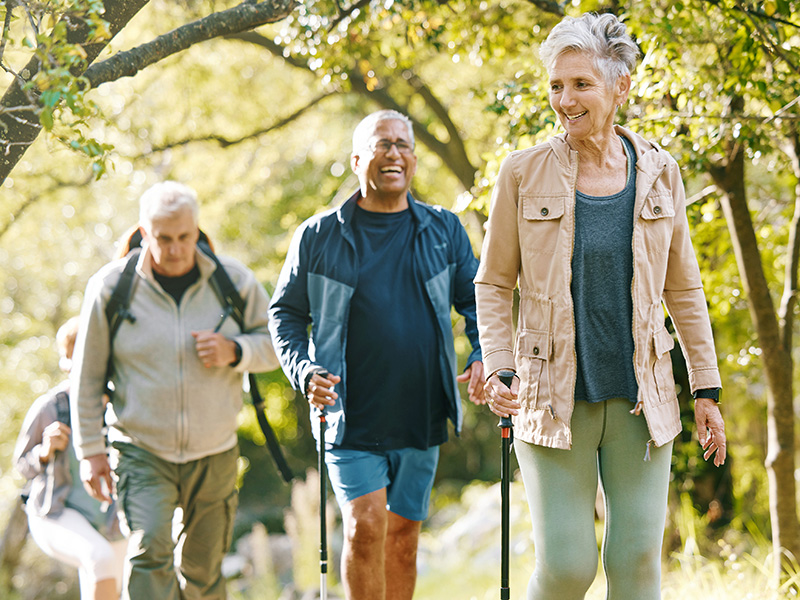 Elderly people hiking outdoors