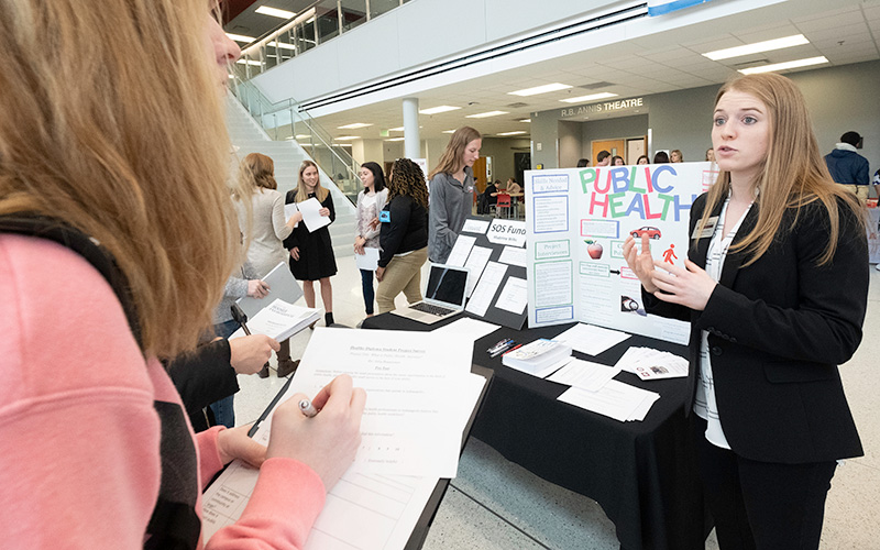 a student doing a presentation on public health