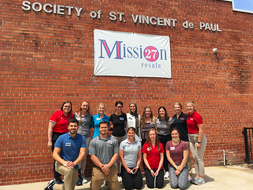 students outside the Society of St. Vicent de Paul building