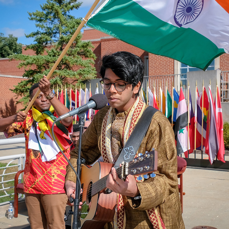 student playing the guitar