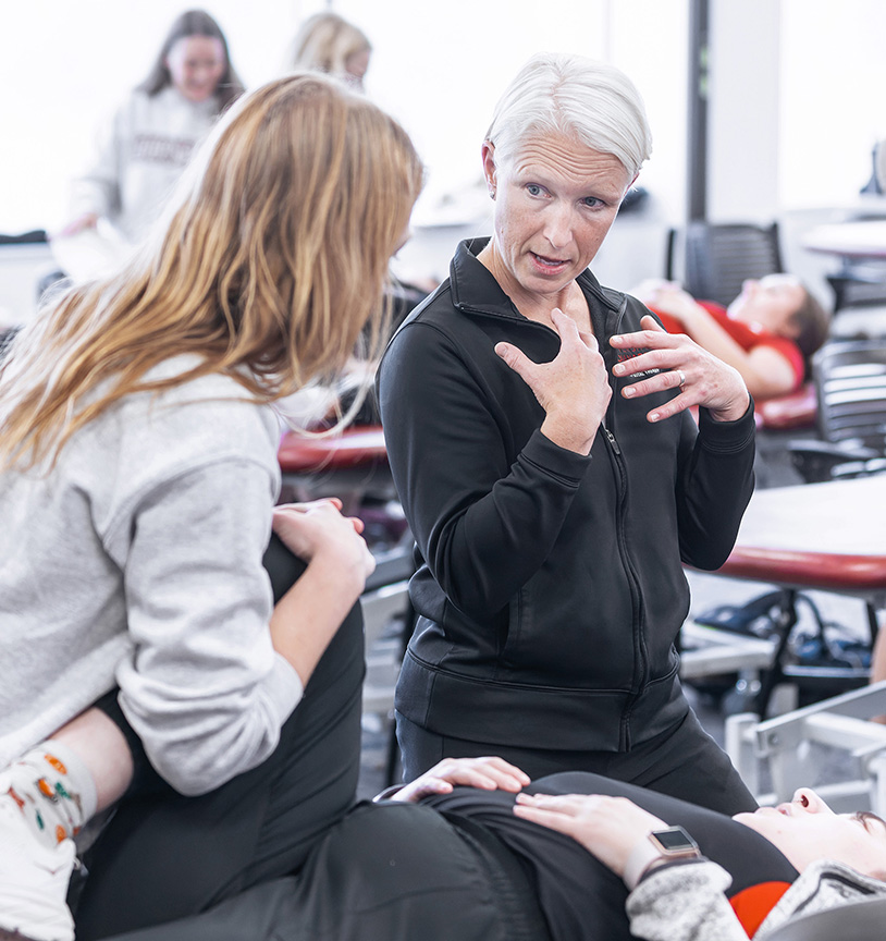 Physical Therapy faculty teaching her students