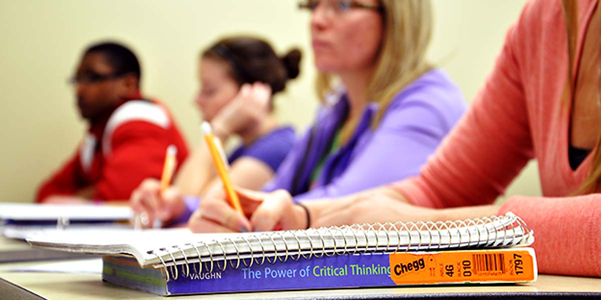 book on table that reads The Power of Critical Thinking