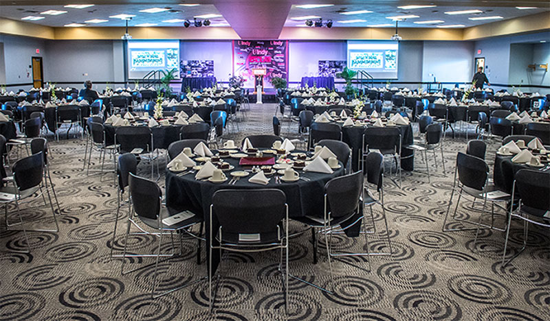 large conference hall with round tables